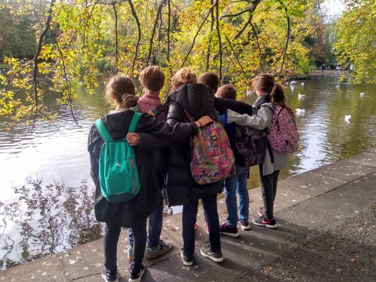 Group Shot from Behind of young students on a trip to st. stephen's green dublin